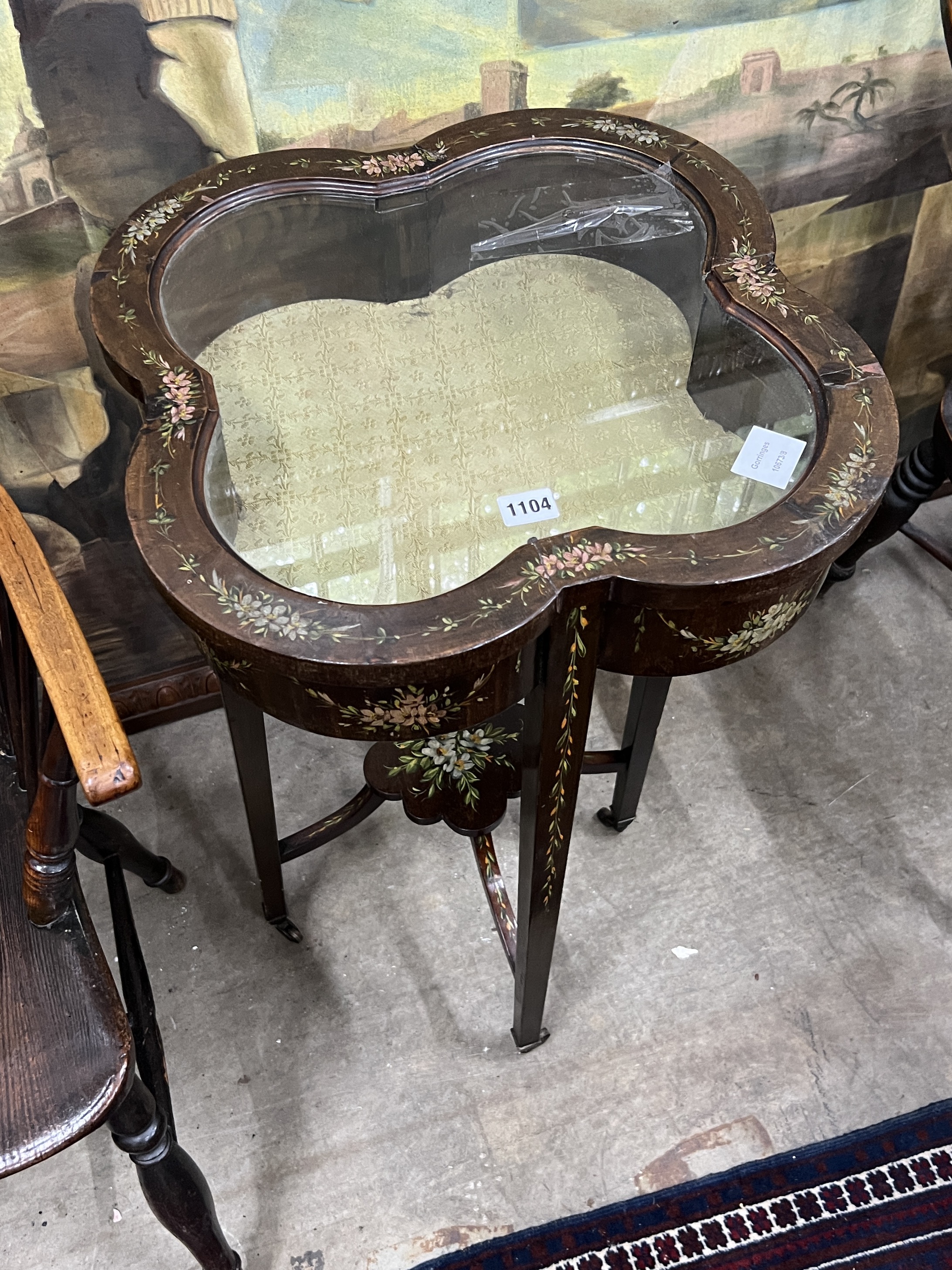 An Edwardian painted bijouterie table of lobed square form, width 44cm, height 77cm